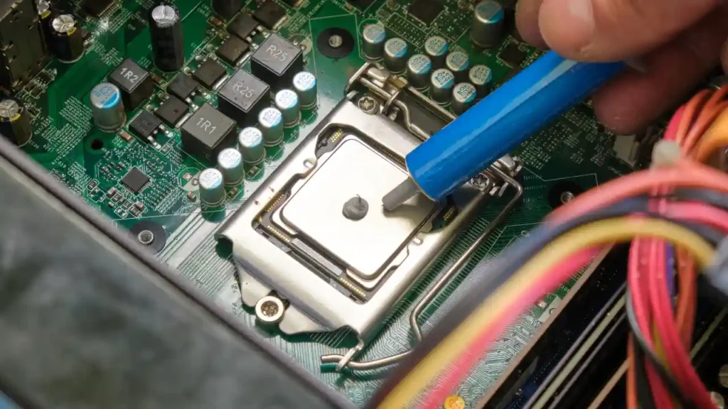 applying-thermal-paste-to-cpu-on-motherboard